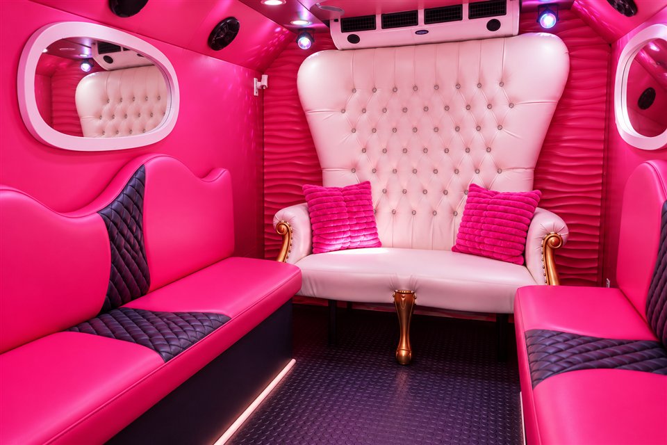 AI illustration of the pink glam bus seating and white tufted chair